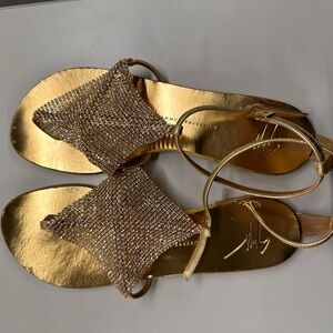 Guiseppe Zanotti Gold Swarovski Crystal Sandals
$50
Good Condition
Size 38/8